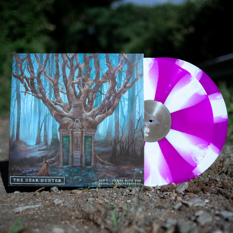 The record is pictured against a background of bushes, with dirt below. The cover of the record is a painting of a forest. In the middle of the forest is a mausoleum with branches growing out of it. The background of the painting is teal and the trees are brown. On the bottom left corner are the words "The Dear Hunter" in white and "Act V: Hymns With The Devil In Confessional" on the bottom right. The vinyl record is white and violet striped.