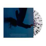 Anberlin - 'Convinced' LP. Vinyl record against a white background. The album cover is dark blue with a blurry, upside down, falling black figure with their hair flowing. There is white text below the figure. There is a vinyl record behind the album cover, which is clear with black and purple splatters.