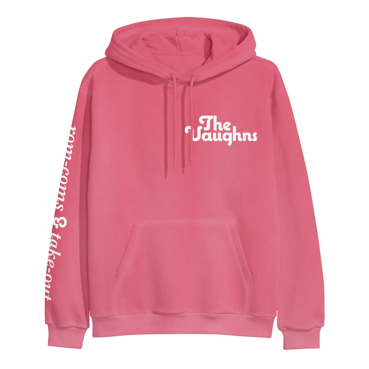 Salmon colored pullover hoodie with white text in the top corner of the chest that says THE VAUGHNS. Down one of the sleeves there is white text that says ROM-COMS & TAKE-OUT.