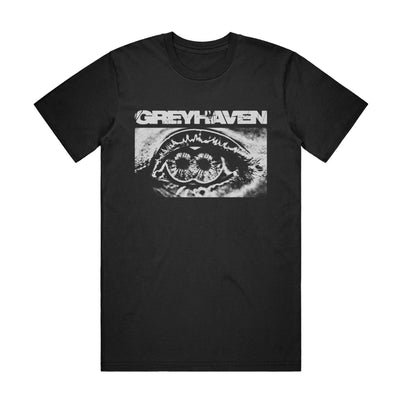 Black short sleeve t-shirt with a black and white graphic of an eyeball with two retinas.  Above the graphic is white text that reads Greyhaven.