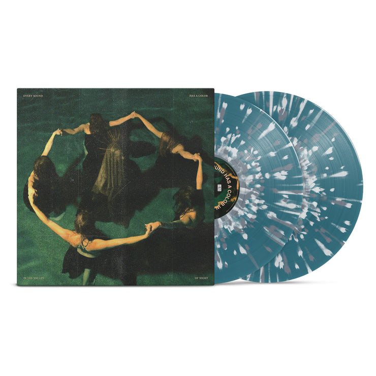 Night Verses Every Sound Has A Color In The Valley Of Night Vinyl LP. Album Art depicts 5 women holding hands around another person or being in a pool together. Vinyl is exposed to show color. color of LP is Blue with White and Grey Splatter. 