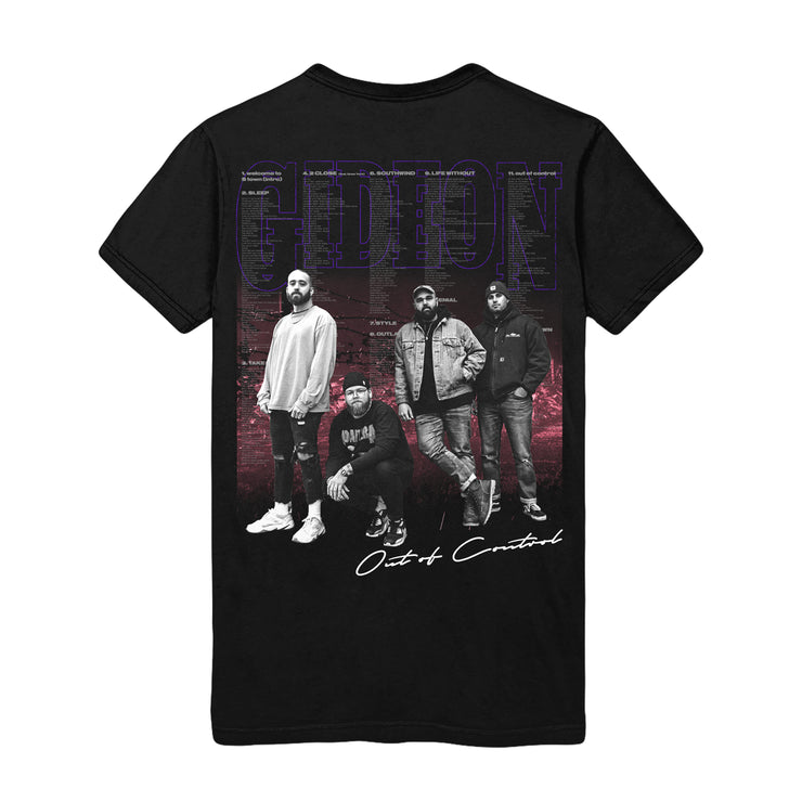 Back of black short sleeve shirt with an image of the band members. Behind the image there is text of song lyrics.