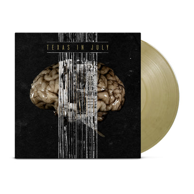 A black background with a picture of a goldish brain in the center of it.  There's a bar of what looks like black and white static going down the middle of the LP and through the brain.  Above the brain reads TEXAS IN JULY in small gold letters.  The LP itself is light gold.