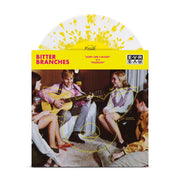 Vinyl jacket with an image of people sitting in a circle and watching a boy play guitar. There is a pig faintly drawn in yellow over the picture.  There is a yellow ribbon across the top. On the top left, "BITTER BRANCHES" is written in red lettering. Towards the center, "ALONG CAME A BASTARD" is written in smaller red lettering. To the top right, there is a rectangle with EVR written on top and bottom. It is written normally on top, but it is being mirrored on bottom. There is a clear and yellow disc.