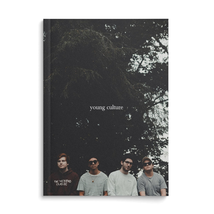 Photo book with young culture written across the center. Behind the text there is an image of the band members lined up in a row and standing in front of trees.