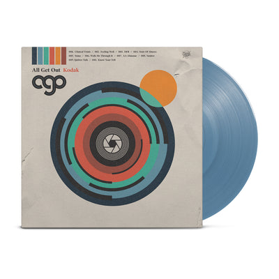 We see a vinyl cover that shows artwork that makes the cover look like a camera. In the middle is a lens and there are other color flares to give the camera style album art personality. Sticking out of the vinyl cover is a vinyl colored light blue.