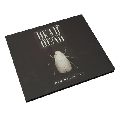 Square CD with DEAD AMERICAN written in white font across the top. The word DEAD is split in half and AMERICAN is written inside it. Below the text there is a white beetle. Below that there is more text that says NEW NOSTALGIA.