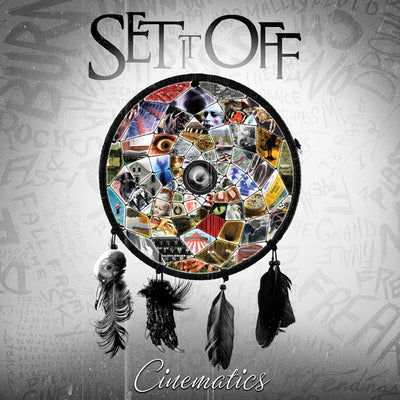 This CD cover has a grey background.  In the middle of the album is a black dreamcatcher with colorful pictures scattered in the middle of the dreamcatcher.  There are 4 black feathers dangling from the bottom of the dreamcatcher.  Above the dreamcatcher reads SET IT OFF  in black letters.  Below the dreamcatcher reads CINEMATICS in black letters.