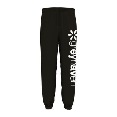 Black sweatpants with a white flower design on the leg. Below the design, "greyhaven" is written vertically in white lettering.