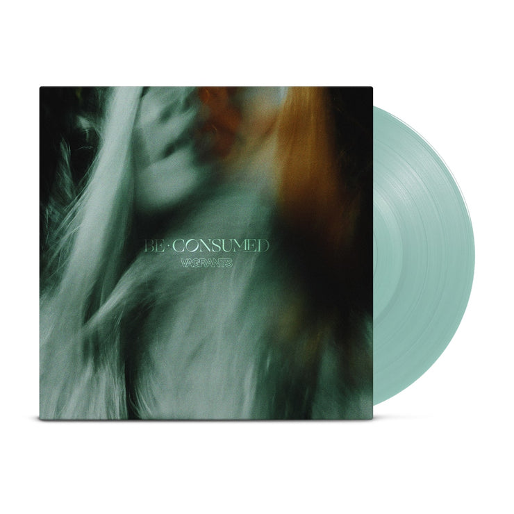 Vinyl jacket with an up close photo of a ghastly looking woman. The vinyl is mint green colored, as well as the disc peeking out of the right side of the jacket. The center of the jacket says BE CONSUMED.