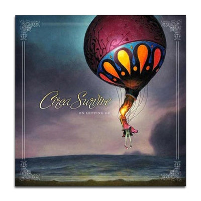 Album cover with Circa Survive written in the middle left in yellow cursive font. Below that is smaller white text that says ON LETTING GO. To the right of the text is a girl with a hot air balloon attached to her head. Th background is a dark and gloomy landscape. Around the edges of the cover is a white border, with embellishments in each corner.