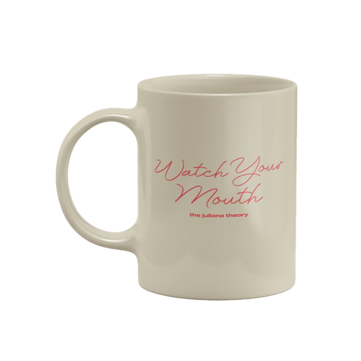 Cream colored coffee mug with "Watch Your Mouth" written in pink cursive lettering. Below that is lowercase pink font writing "the juliana theory"