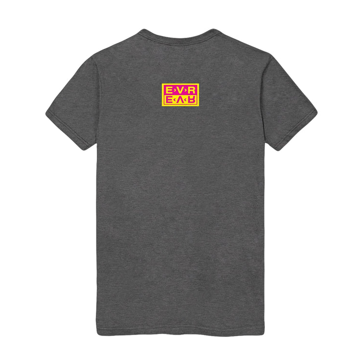Grey short sleeve shirt with small rectangle on back of shirt. EVR written inside in yellow with red background. Below that, EVR is written mirrored in red, with a yellow background.