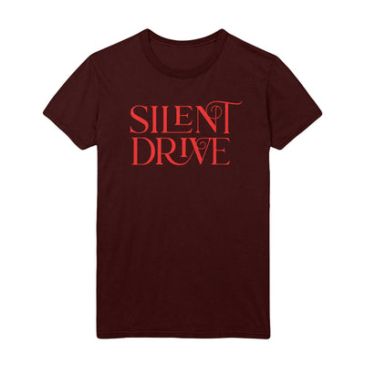 Image is a Maroon Tee shirt with Red Lettering that reads “Silent Drive” across the chest