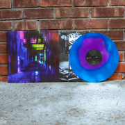 Vinyl jacket with artwork of an alley. The entire design is multicolored green, dark blue, purple, and pink. At the end of the alley is a car with its rear lights on. To the right of the jacket is a magenta and dark blue vinyl. The vinyl is leaning against a brick wall.
