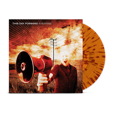 Orange colored vinyl jacket with a man with a megaphone. The man's mouth is open as if he's yelling. In the back there is a telephone pole and wires. The entire background is an open field. In the top left there is text that says THIS DAY FORWARD IN RESPONSE. Peeking out of the jacket is an orange and maroon splattered vinyl.