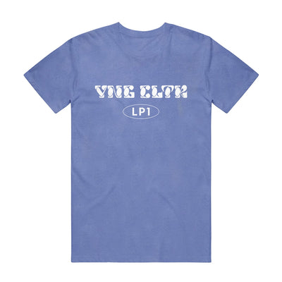 Periwinkle short sleeve shirt with "YNG CLTR" written across the chest in white bubble lettering. Below that is an oval, and inside "LP1" is written.
