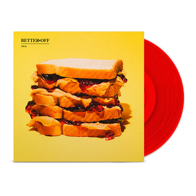 Yellow vinyl jacket with an image of a multiple layered sandwich. In the top left there is small text that says BETTER OFF, and below it there is smaller text that says MILK. Peeking out of the jacket is a red colored vinyl.