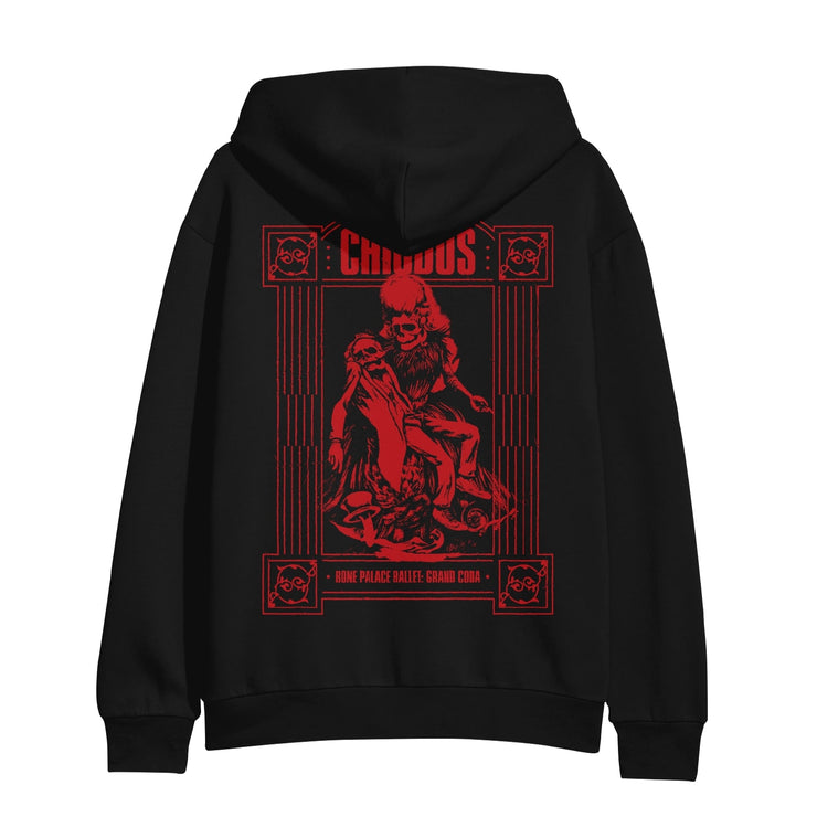 Back of black pullover hoodie with a drawing of two skeletons, one holding the other in red. On top of the skeletons there is red font that says CHIODOS. 