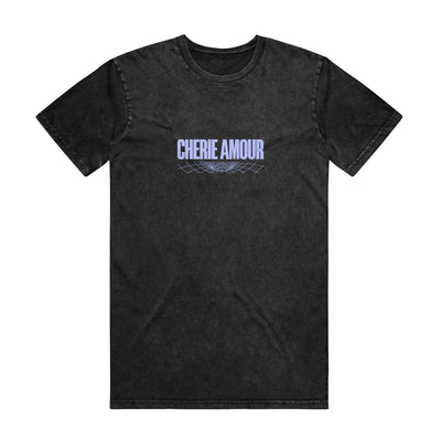 Black short sleeve shirt with CHERIE AMOUR written across the chest in periwinkle font. Underneath that is a design made of a series of curved lines.