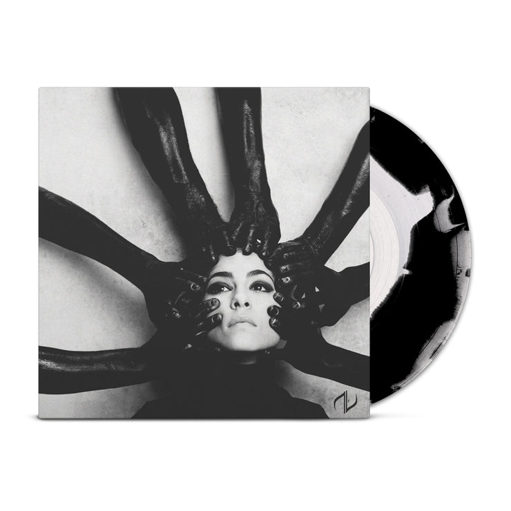 Vinyl jacket with an image of a woman's face. There are hands with black gloves on reaching at her face from all directions. Peeking out of the vinyl jacket is a black and white vinyl.