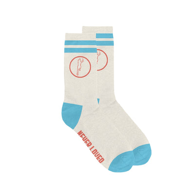 Cream colored socks with blue accents and a red circular design on the top. NEVER LOVED is written in red on the bottom of the socks.