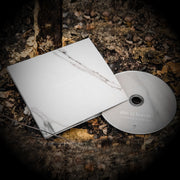 Square CD, white and grey marble design with white lettering writing (this is) heaven. CD cover and disc (same design as cover) spread out on dead leaves.