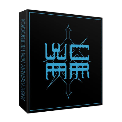 Black box with light blue trim. "WCAR" spelled out in a square shape in the same light blue. Behind the lettering is a diamond shaped design, in the same light blue. Along the side of the box, "WE CAME AS ROMANS" is written vertically in light blue font.